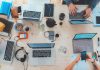 Unlocking Business Potential: How AI Search Platforms Transform Information Retrieval A group of professionals collaborating on laptops at a table, focused on a top AI search platform project.
